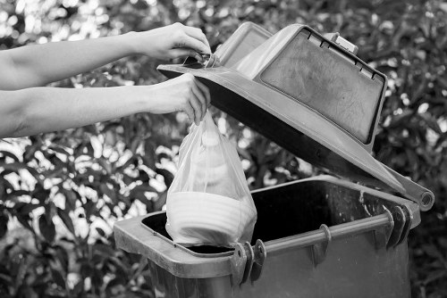 Gardener performing garden clearance in a Mitcham garden